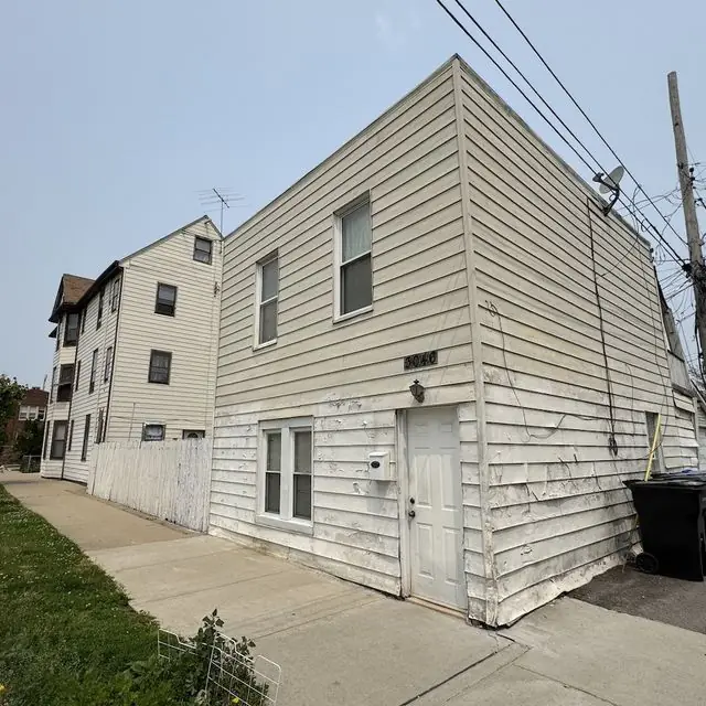3801 N. Albany Ave.: As bought · rear